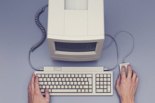 A hand using a Retro computer