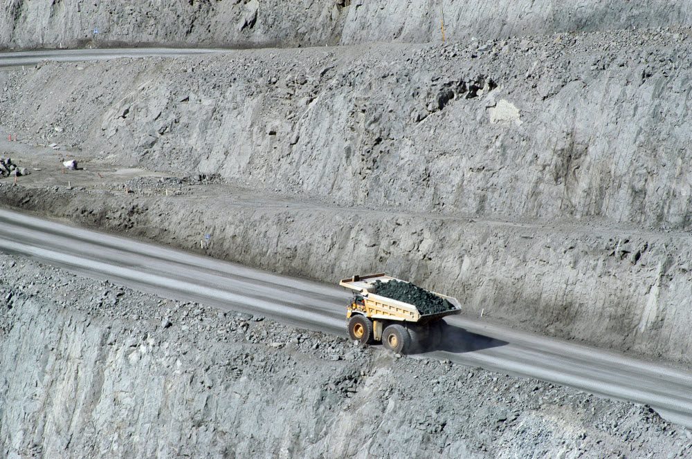 Truckfull of rocks and sand in a goldmine site